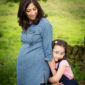 Pregnant mother and daughter portrait